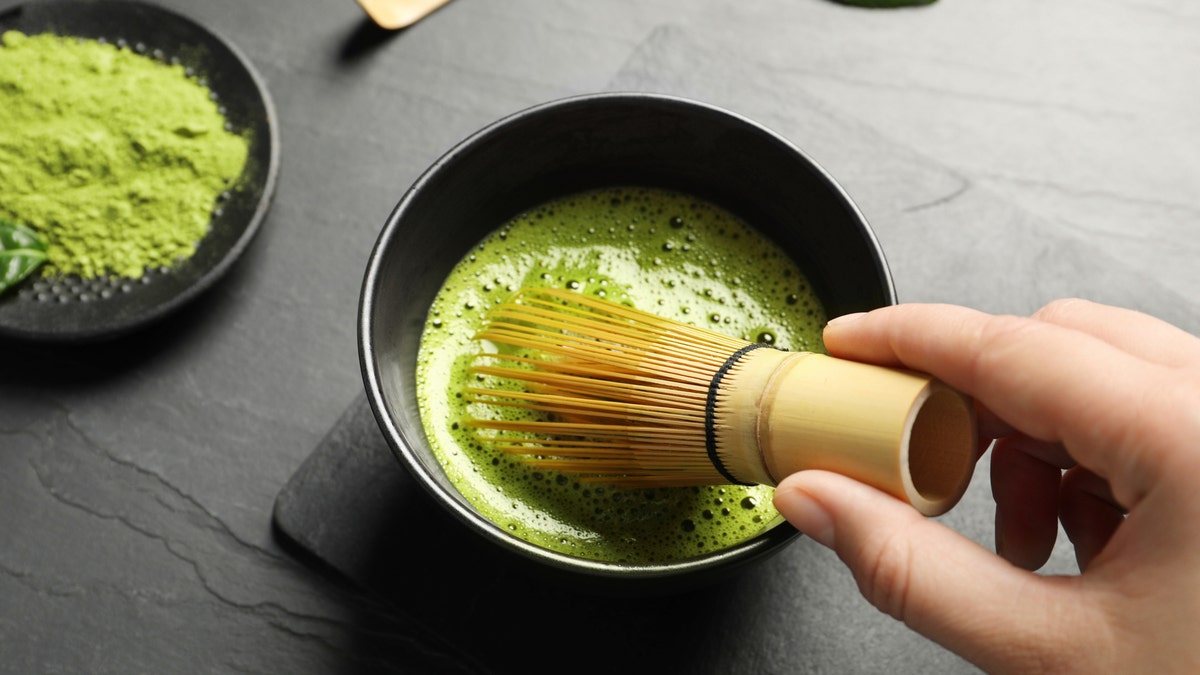 Matcha being prepared in a bowl