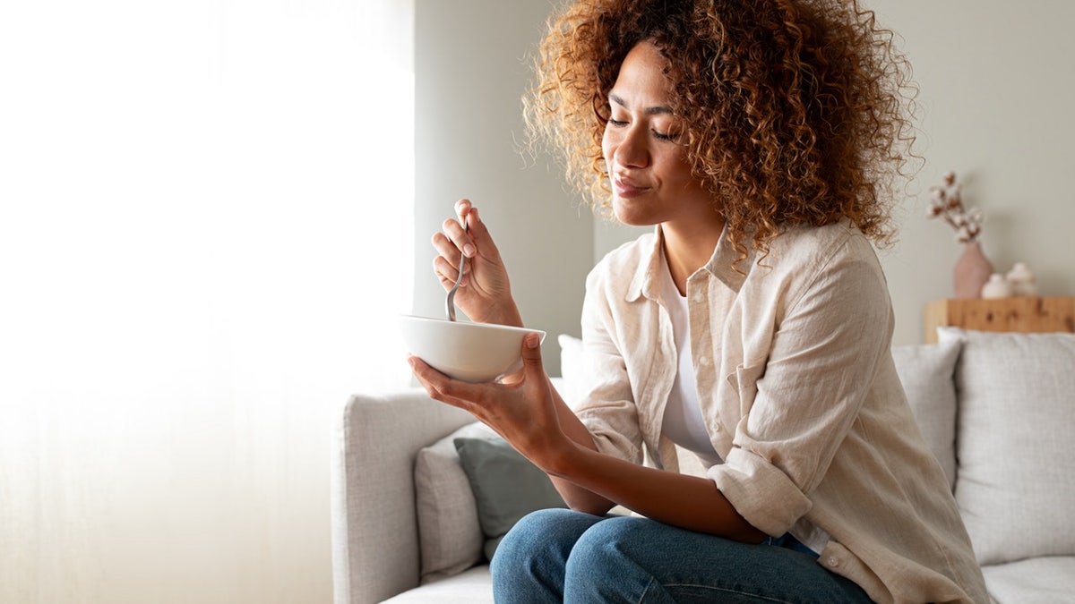 Woman eating breakfast