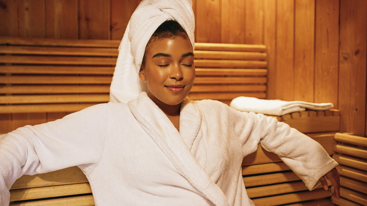 A woman sitting in the sauna