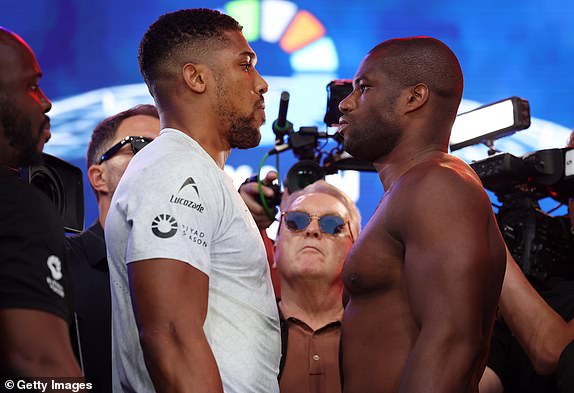 LONDON, ENGLAND - SEPTEMBER 20:  Anthony Joshua and his opponent Daniel Dubois face off during their Weigh In as part of the Riyadh Season - Wembley Edition card at Trafalgar Square on September 20, 2024 in London, England.  (Photo by Mark Robinson/Matchroom Boxing/Getty Images).