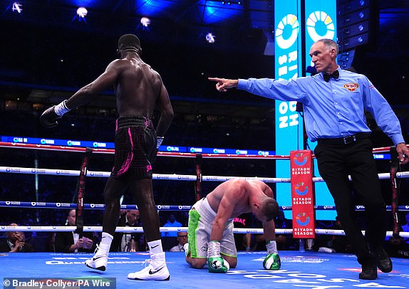 Joshua Buatsi knocks down Willy Hutchinson in the WBO Interim World Light Heavy weight bout at Wembley Stadium, London. Picture date: Saturday September 21, 2024. PA Photo. See PA story BOXING London. Photo credit should read: Bradley Collyer/PA Wire.RESTRICTIONS: Use subject to restrictions. Editorial use only, no commercial use without prior consent from rights holder.