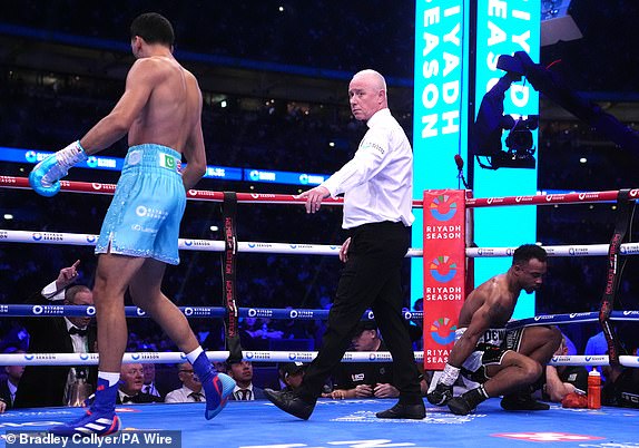 Hamzah Sheeraz (left) defeats Tyler Denny by Technical Knockout in the EBU European Middle weight bout at Wembley Stadium, London. Picture date: Saturday September 21, 2024. PA Photo. See PA story BOXING London. Photo credit should read: Bradley Collyer/PA Wire.RESTRICTIONS: Use subject to restrictions. Editorial use only, no commercial use without prior consent from rights holder.