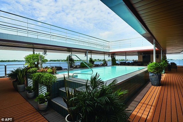 Jo says: 'Unusually for a river ship, the stunning outdoor pool [above] is big enough for a swim ¿ 100 lengths takes half an hour'