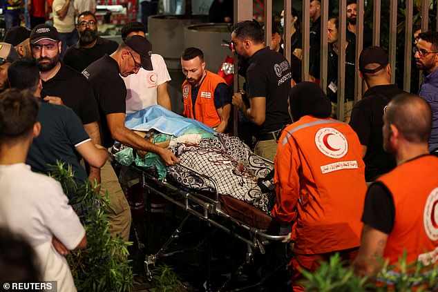 A person is carried on a stretcher outside American University of Beirut Medical Center (AUBMC) as people, including Hezbollah fighters and medics, were wounded and killed when the pagers they use to communicate exploded across Lebanon, according to a security source, in Beirut, Lebanon September 17, 2024