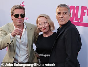 Amy later crossed paths with her co-stars, Brad and George, and they paused for a photo session together on the red carpet