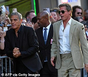 Pitt and Clooney took time to spend time with fans that were waiting outside the venue