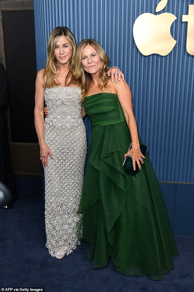 The two friends put on a united front when they arrived together at the Emmys. They were seen exiting Aniston's front entrance, which has towering doors covered in irregular gray stripes