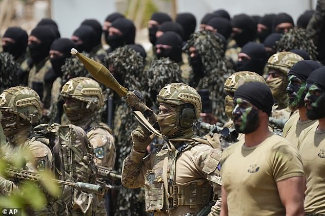 Fighters from the Lebanese militant group Hezbollah carry out a training exercise in Aaramta village in the Jezzine District, southern Lebanon, Sunday, May 21, 2023