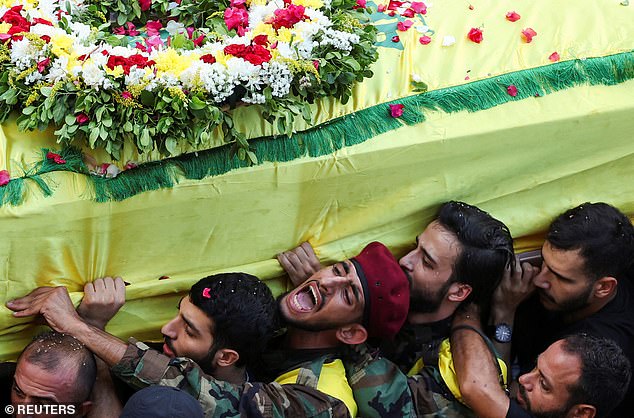 Men carry the coffin of Mohammad Mahdi Ammar, son of Hezbollah member of the Lebanese parliament, Ali Ammar, who was killed amid the detonation of pagers across Lebanon, during his funeral in Beirut, Lebanon September 18, 2024