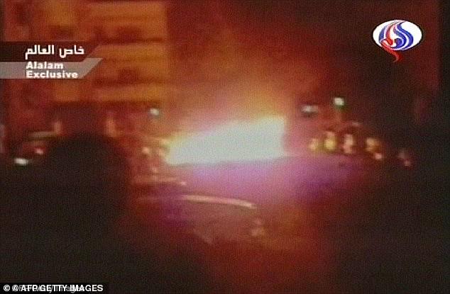 A TV still shows the moment the vehicle the man dubbed 'Osama Bin Laden' of the eighties was caught in the vehicle blast