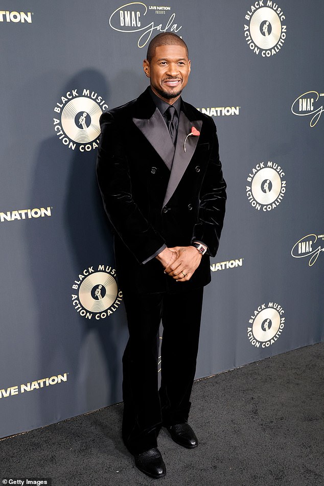 Usher cut a striking figure at the BMAC gala red carpet in an all-black ensemble built around a velvet tuxedo