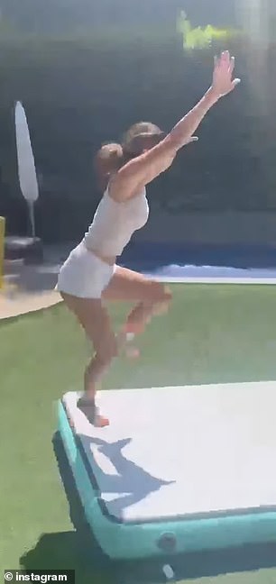 She included footage of the teen showing off her impressive tumbling skills on a training mat in the backyard of their Los Angeles home