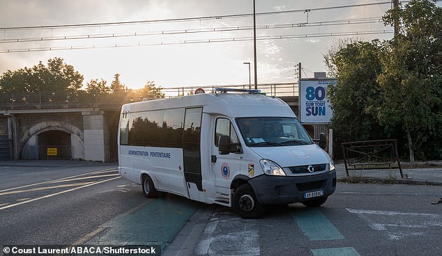 A prison van arrives at the courtroom in Avignon on September 20