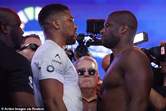 Both fighters maintained discipline when facing off following the weigh in as crowds watched on