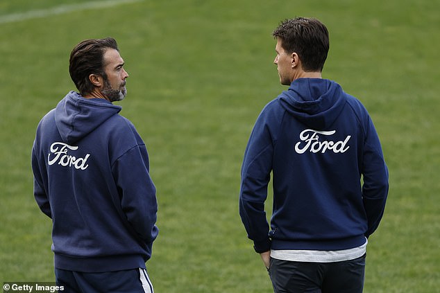 Geelong Cats coach Christ Scott speaks with general manager of football Andrew Mackie at the training session