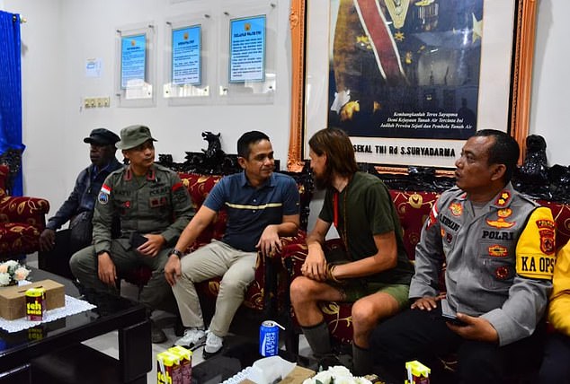 Indonesian authorities released a picture of Mr Mehrtens with police officers who secured his release