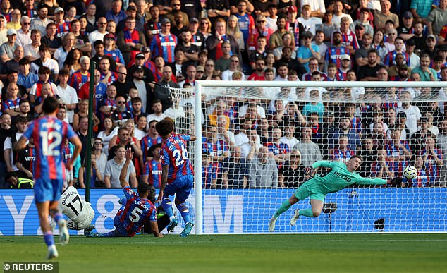 Henderson sprawled across to his left to tip Garnacho's effort wide of the far post