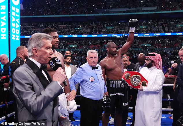 Legendary announcer Michael Buffer calling out a victorious Dubois' name after his win