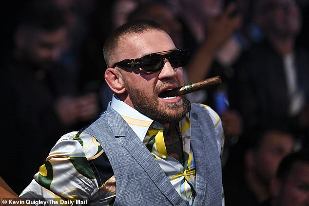 UFC legend Conor McGregor watched the fight while holding an unlit cigar in his mouth