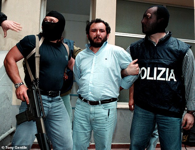 Brusca being escorted to prison by anti-mafia police in Palermo. The mafia fugitive was sentenced to 30 years in jail, but was released five years early for good behaviour in 2021