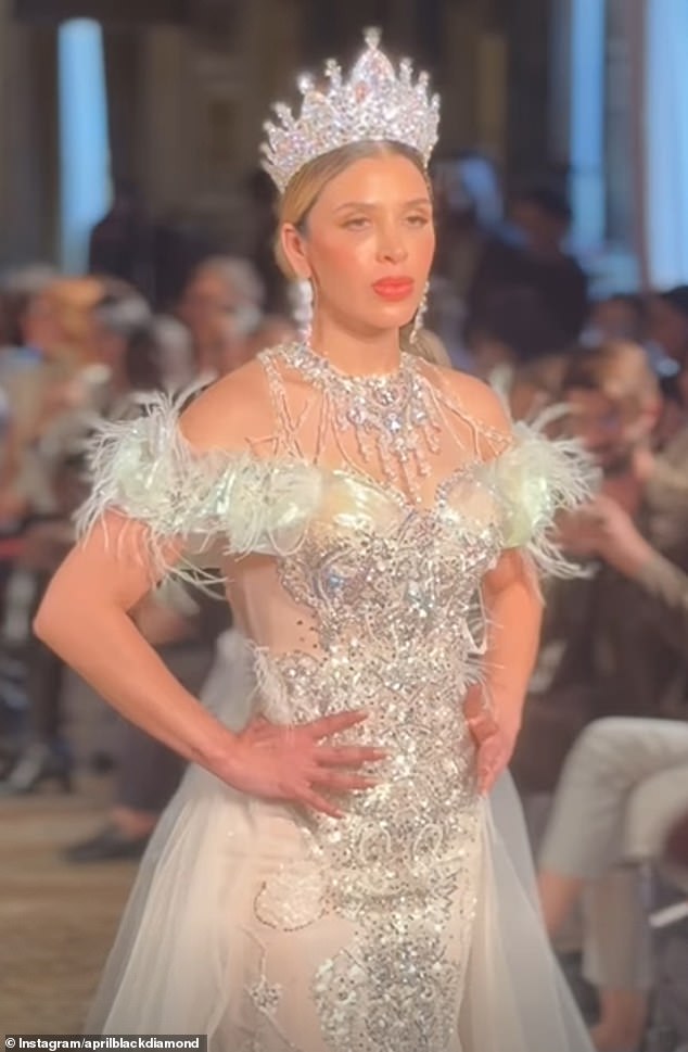 The stunning ensemble boasted a glitzy crown and lavish silver jewellery, with an off-the-shoulder cut