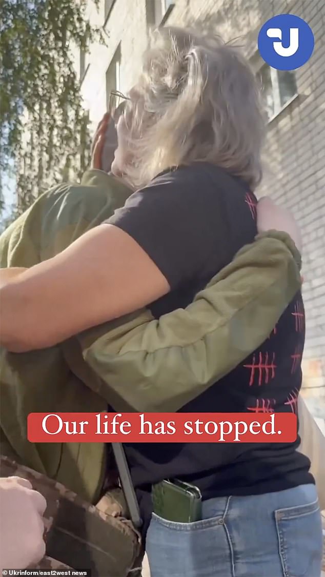 Footage shows the pair hugging, with Hulchuk's mother telling him: 'We love you, we really love you. Without you, we didn't have a life. You are our sun, our joy, our pride, our love'