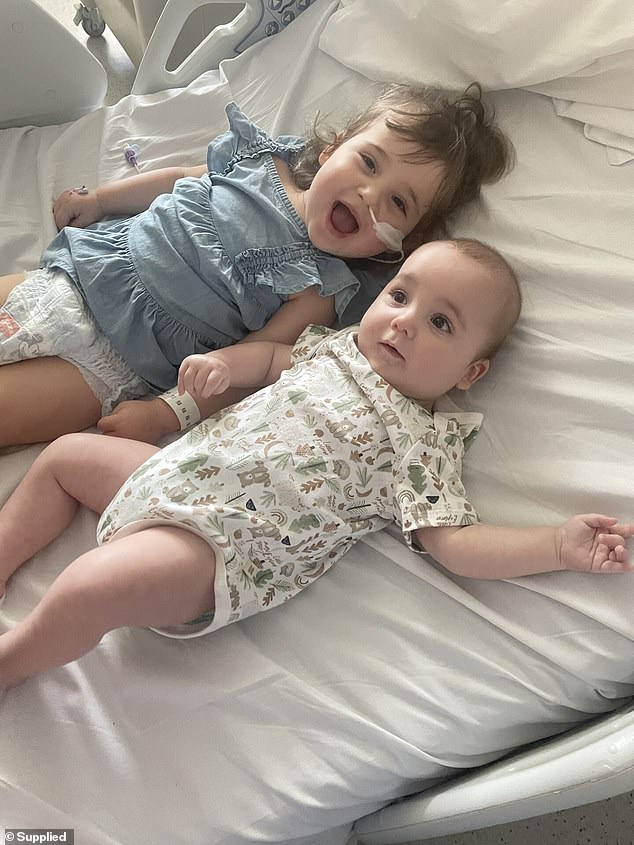 Bella's parents first realised something was wrong when they spotted her limping, but quickly lost strength to lift her arms, walk or swallow over the next two weeks (pictured, left)