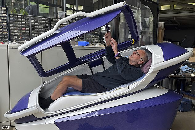 Philip Nitschke lies down in a 'suicide pod' known as 'The Sarco' in Rotterdam, The Netherlands, July 8, 2024