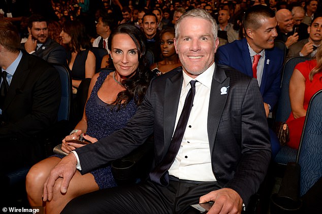 Favre sits alongside his wife Deanna at the 2015 ESPY Awards in Los Angeles, California