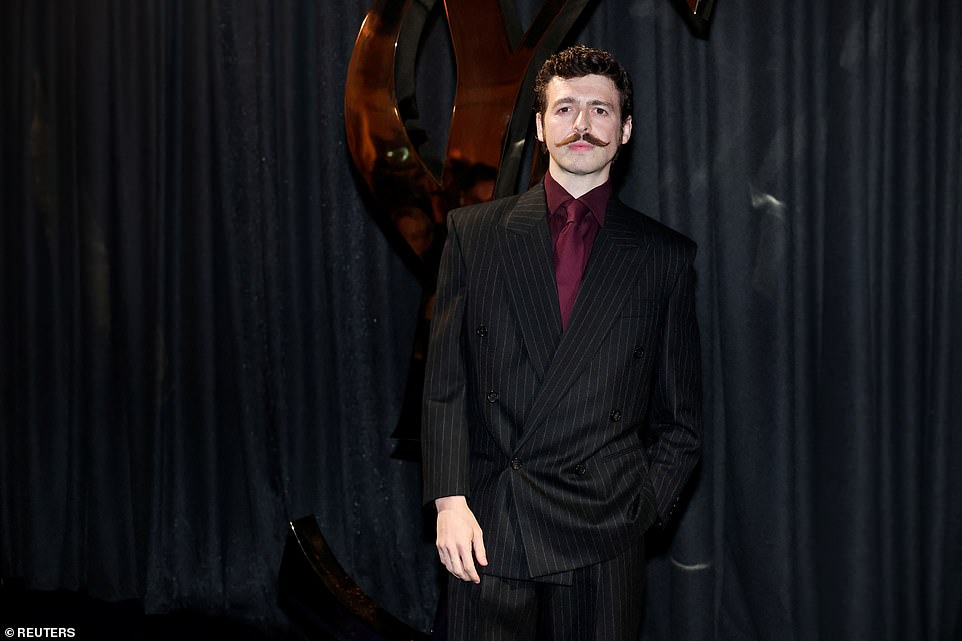 Anthony Boyle followed the show's theme in a black and burgundy look