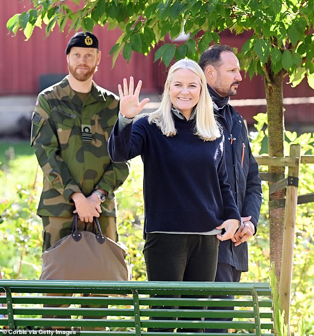 Mette Marit beamed as she waved to onlookers, in a smile that betrayed not a hint of stress amid the scandal rocking the Norwegian royals