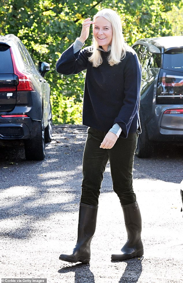 Mette-Marit donned practical black Wellington boots as she arrived at the farm