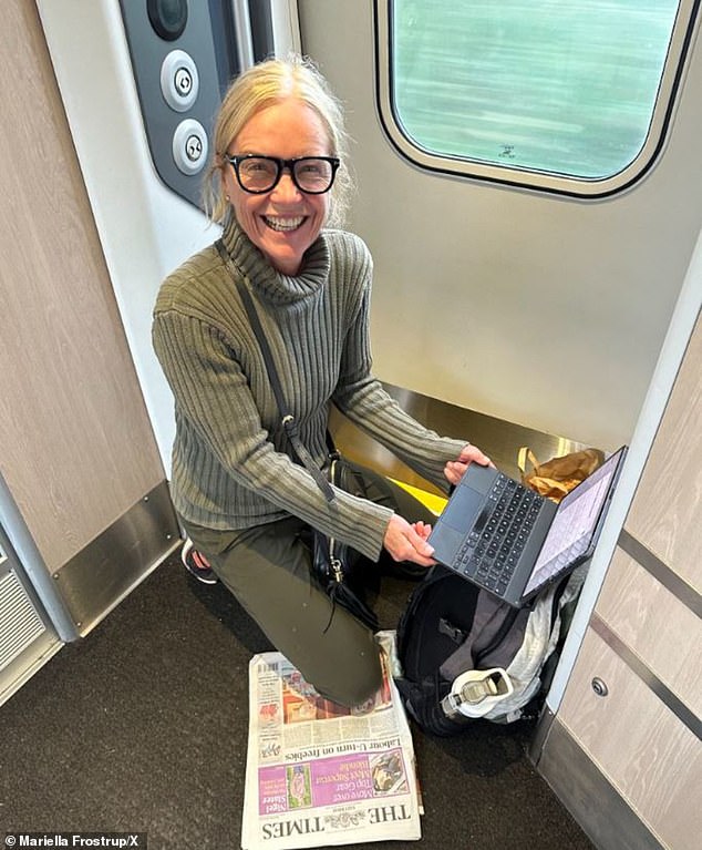 Mariella Frostrup sitting on the train floor