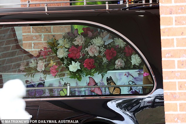 Charlotte O'Brien's casket was covered with painted butterflies and lavender (pictured)