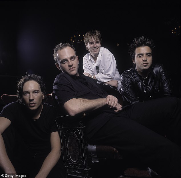 The singer, 50, has revealed the band will continue, in two forms, after he was locked in a bitter legal dispute with former bandmates. Pictured from left: Tim Wild, Tim Watson, Daniel Hall and Jason Singh