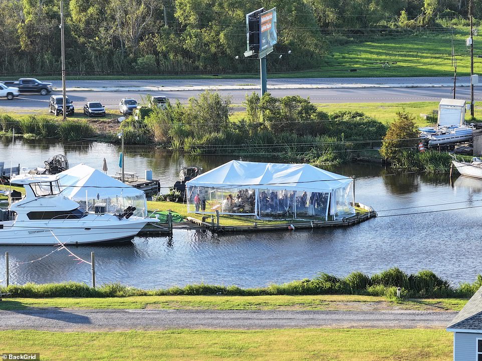 A stunning white yacht was parked right in front of the wedding spot