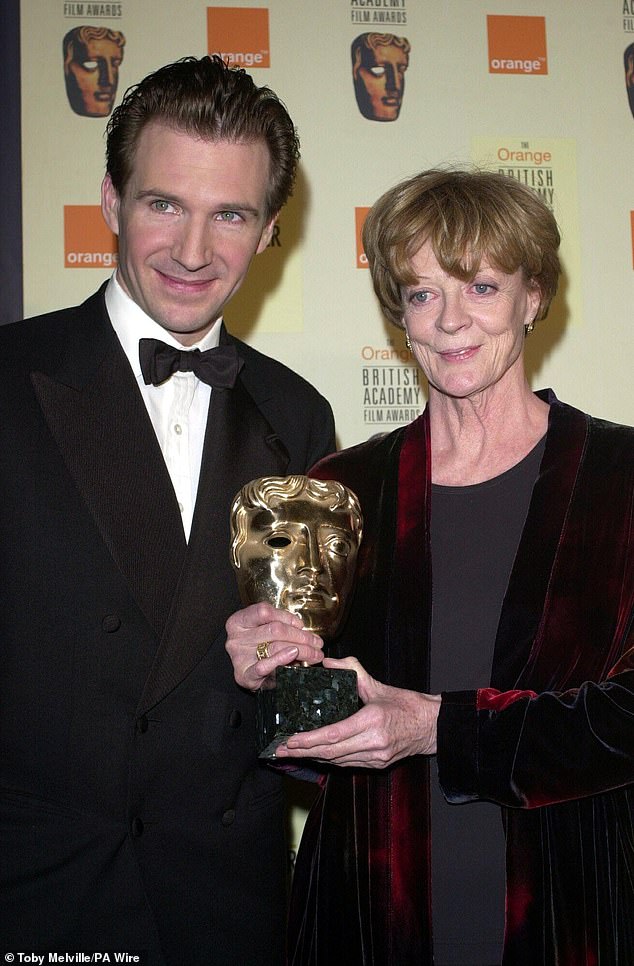 Ralph Fiennes presents Dame Maggie Smith with a Bafra award for Best Supporting Actress for the film 'Tea With Mussolini' at the Odeon Leicester Square in London on April 9, 2000