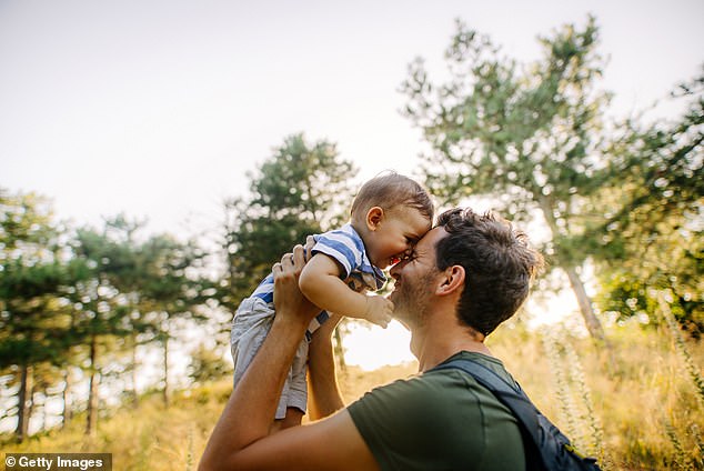 Scientists believe that the smell of a parent's own child activates parts of the brain associated with pleasure and reward, helping to promote a loving relationship (stock image)