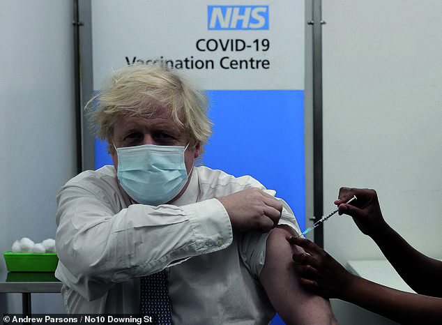 Mr Johnson receives his Covid vaccine at St Thomas's Hospital in London in December 2021