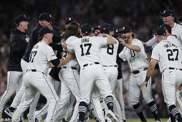 Tigers players celebrate their playoff berth after beating the worst team in MLB history