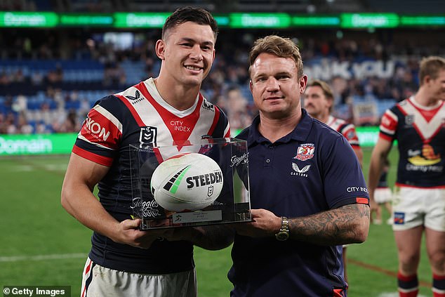 Roosters stalwart Jake Friend presents Joseph Manu with a commemorative ball before his move to Japanese rugby