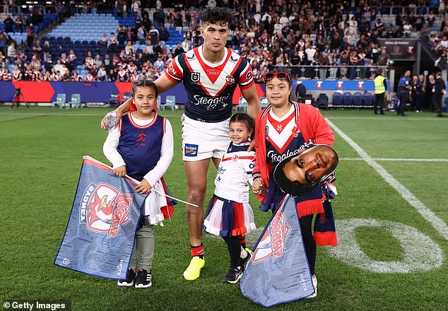 Joseph Aukuso-Suaalii poses for a photo with fans before he departs to join the Wallabies