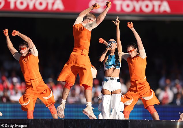 She was joined on stage by an array of backup dancers clad in orange ensembles as they attracted attention on the main stage