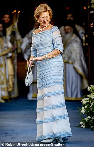 For her daughter's big day, Queen Anne-Marie sported a striking blue striped gown and matching accessories