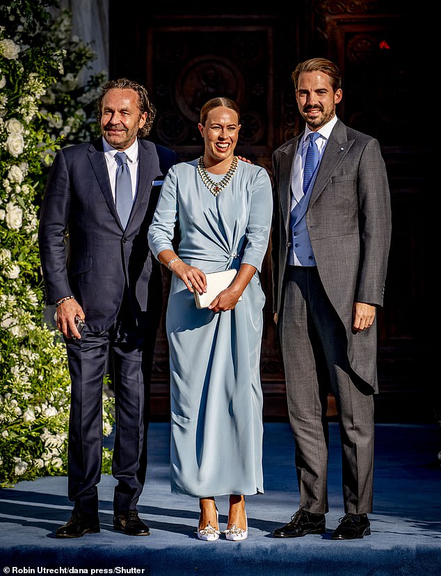 Thomas Flohr, Prince Philippos and Princess Nina posed for a photo before attending the wedding