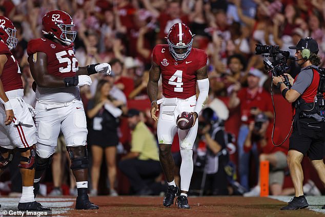 Jalen Milroe #4 of the Alabama Crimson Tide celebrates after scoring a rushing touchdown