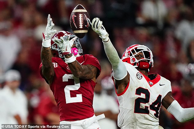 Alabama Crimson Tide wide receiver Ryan Williams (2) reaches for a pass against Georgia Bulldogs defensive back Malaki Starks