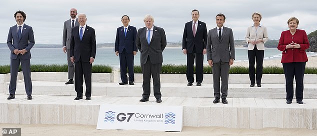 Leaders of the G7 pose for a group photo at Carbis Bay, St Ives, Cornwall