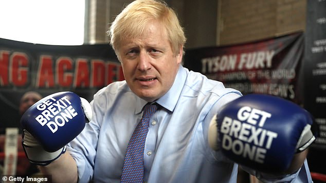 Mr Johnson on the Brexit campaign trail in 2019 at at Jimmy Egan's Boxing Academy in Manchester