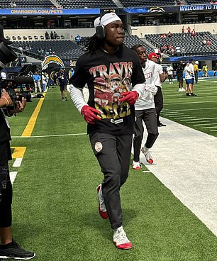 Rashee Rice wearing a Travis Kelce t-shirt